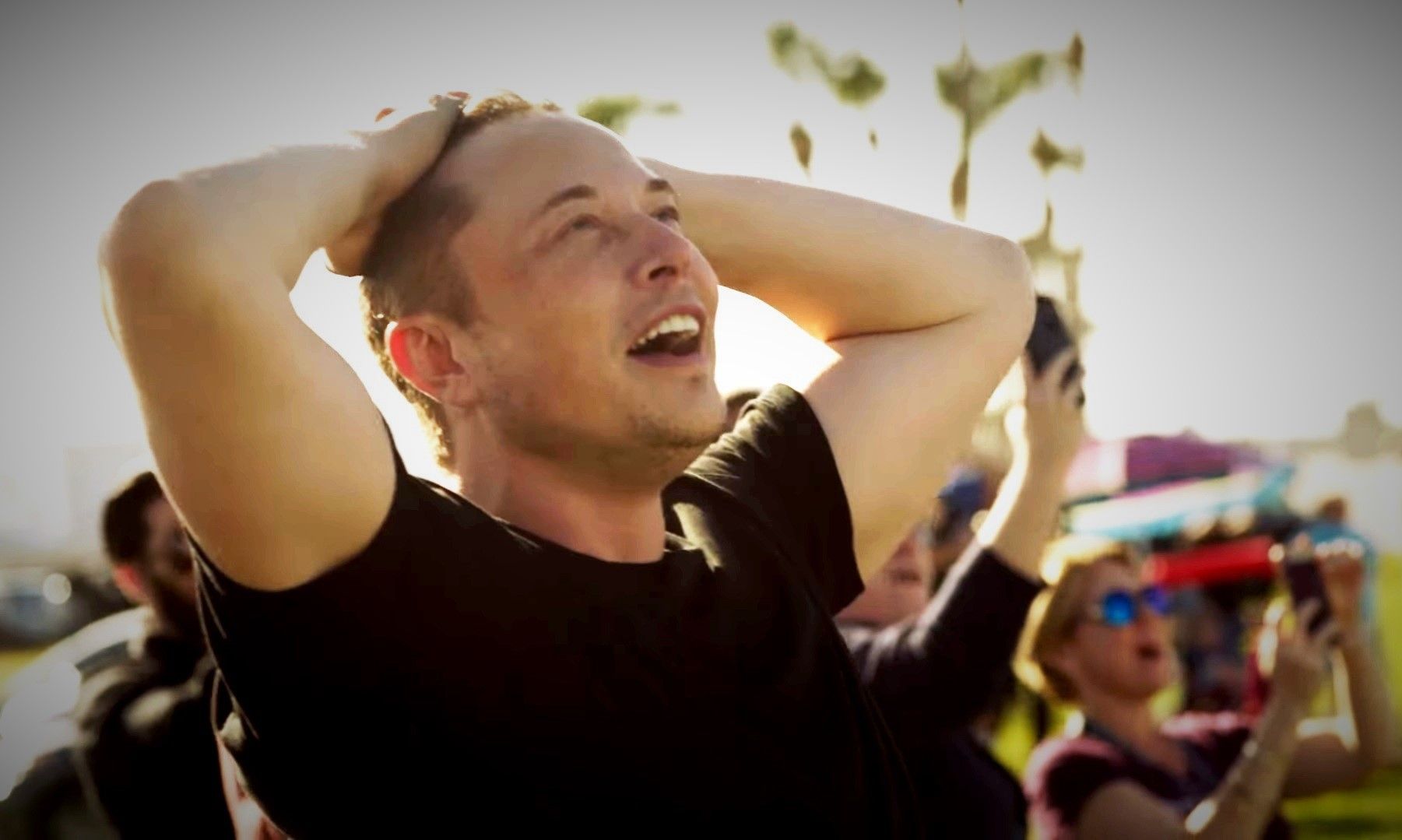 Elon Musk is watching a SpaceX rocket's rising!